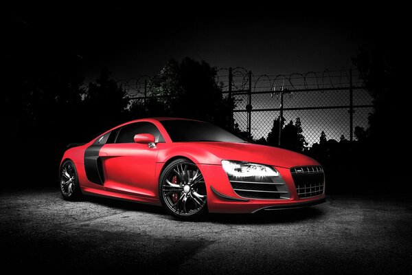 Audi R8 rojo sobre fondo negro