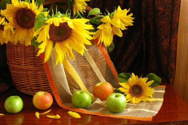 Still life of sunflowers and apples in a basket