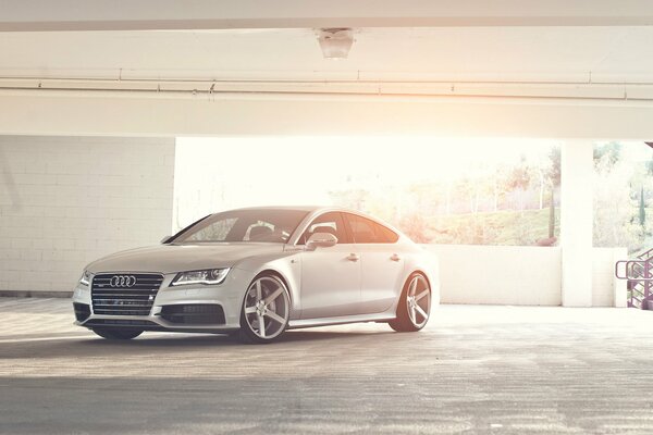 AUDI brand car in a multi-level parking lot