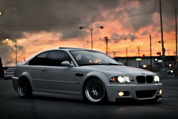 White car on sunset background