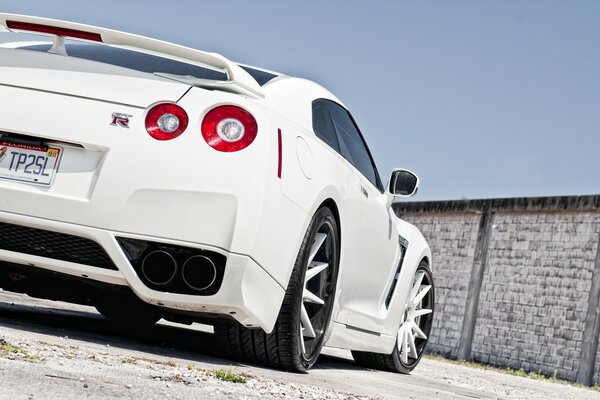The back of a white nissan gt-r