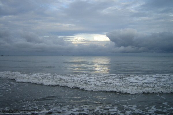 Foamy sea breeze and clouds