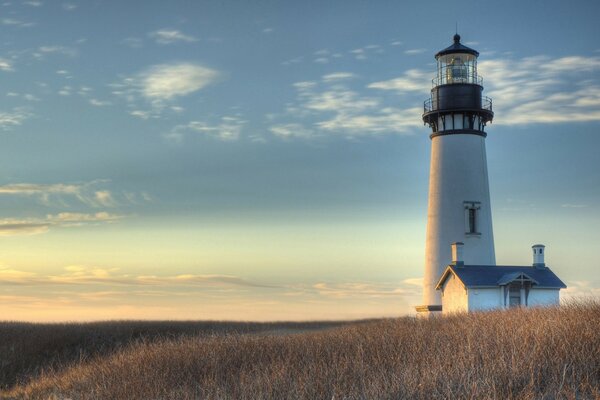 Sunrise. Lighthouse. Sky