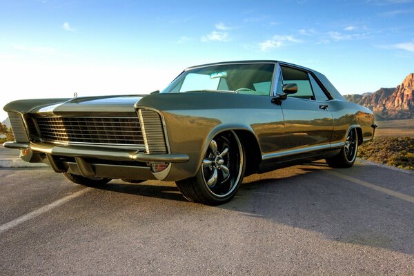 Tinted oil car 1965 green on a deserted road