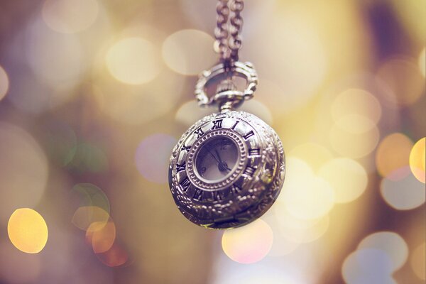 Macro photography of an antique clock, against the background of glare