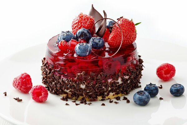 Dessert with fruit and berries on a white plate