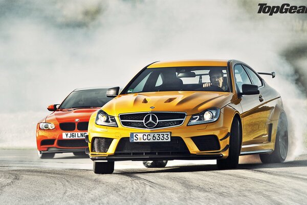 Mercedes-benz two cars on a supercar