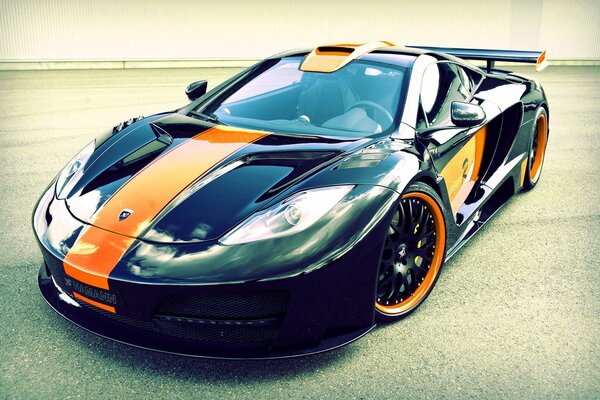 Black sports car with orange decorative elements