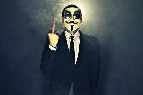 Un homme avec des lunettes et un masque d Anonymous