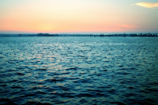 Splashes of sea waves on the sunrise