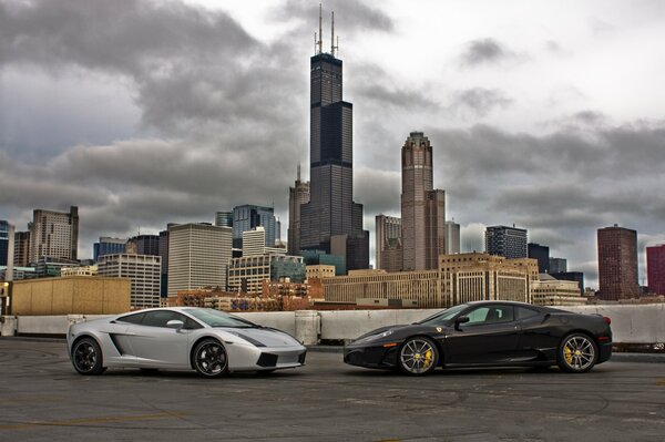 Ferrari and Lamborghini on the background of the city