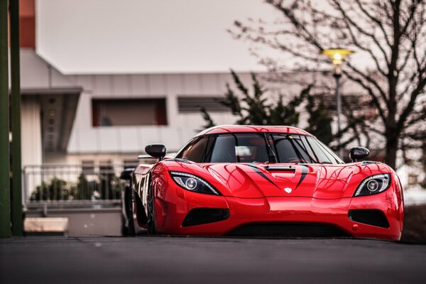 Bright red car in the evening