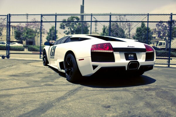 White supercar on a city street