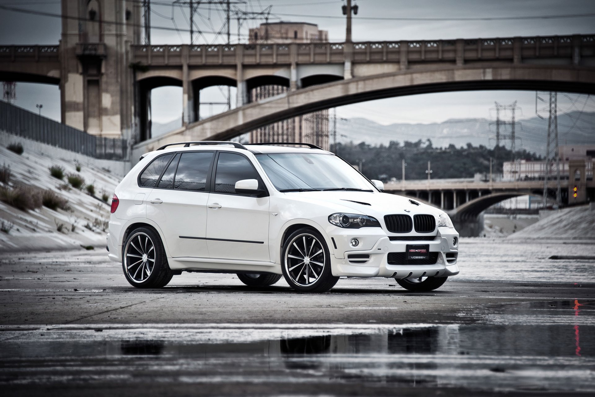 bmw x5 white bmw crossover front bridge puddle reflection