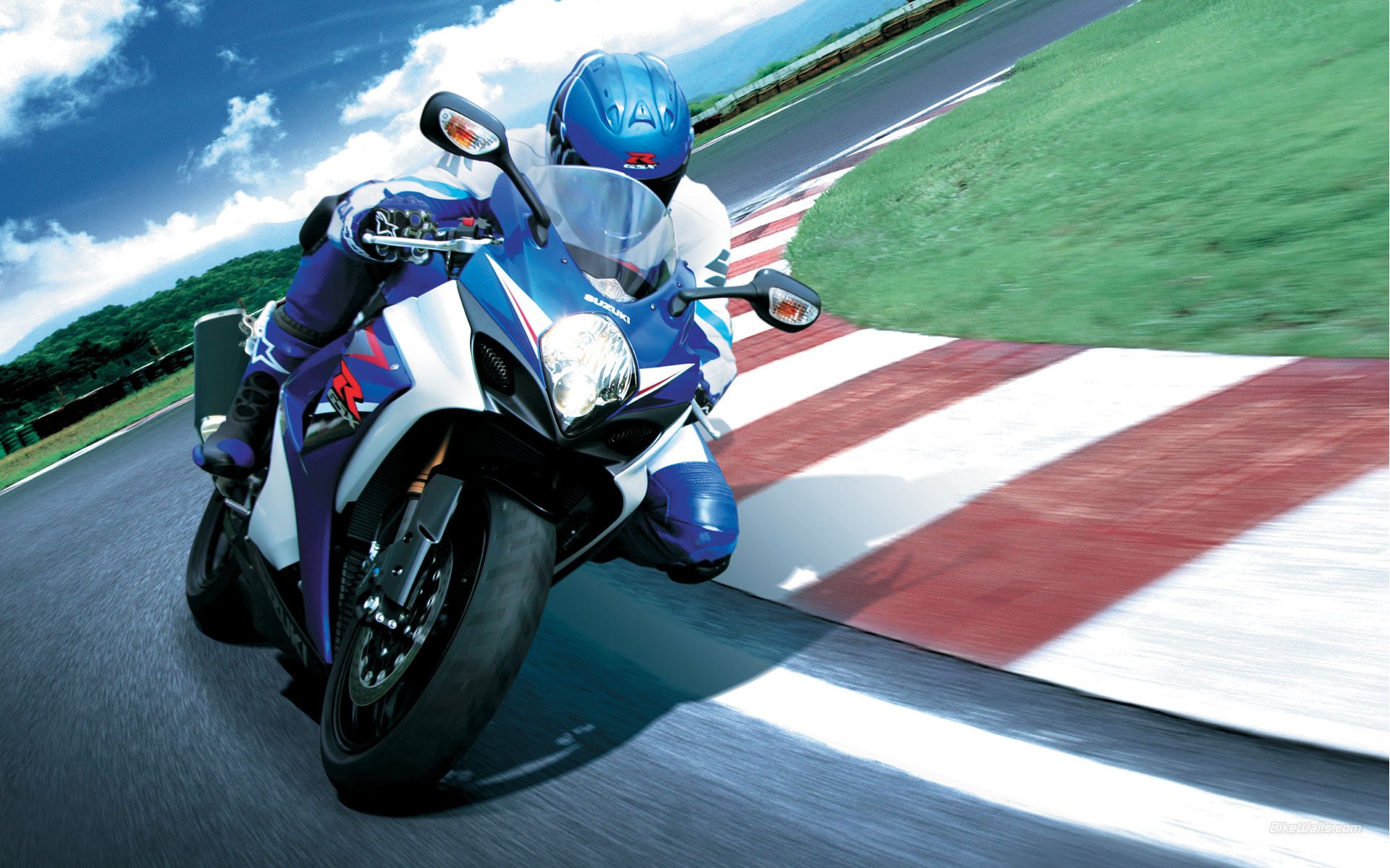 uzuki gsx-r 1000 suzuki gsix-r jixer motorcycle superbike racer.race track turn turn slope curb sky gra