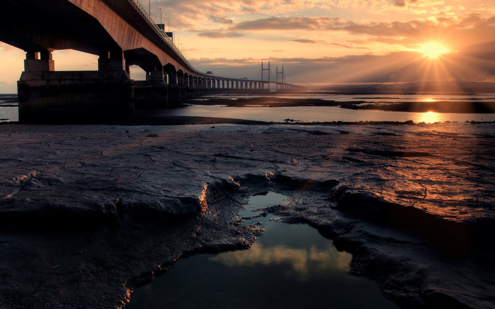 most brzeg morze ocean słońce kamienie