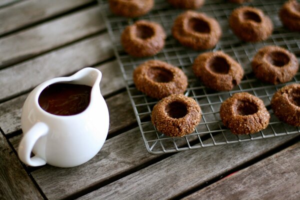 Delicious chocolate cookies and a saucepan with chocolate