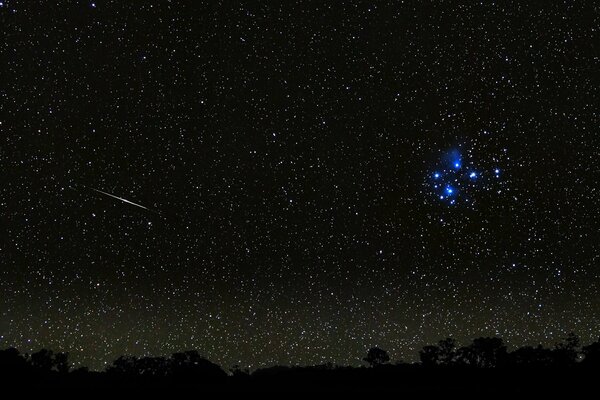 A meteor in the night starry sky
