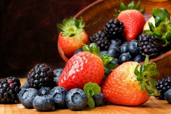 Still life of forest and garden berries