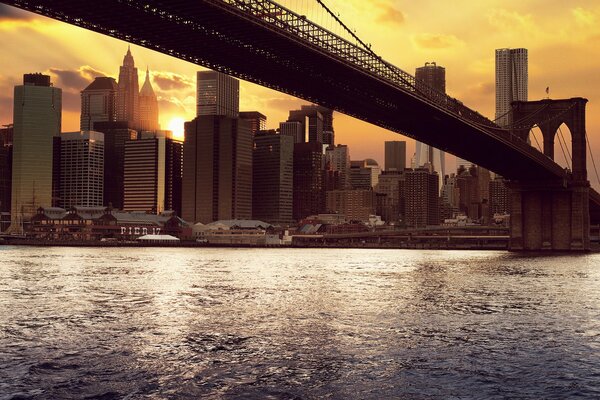 Skyscrapers at sunset with a view of the bridge