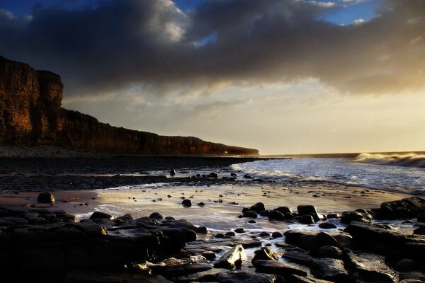 The seashore after a storm at sunset