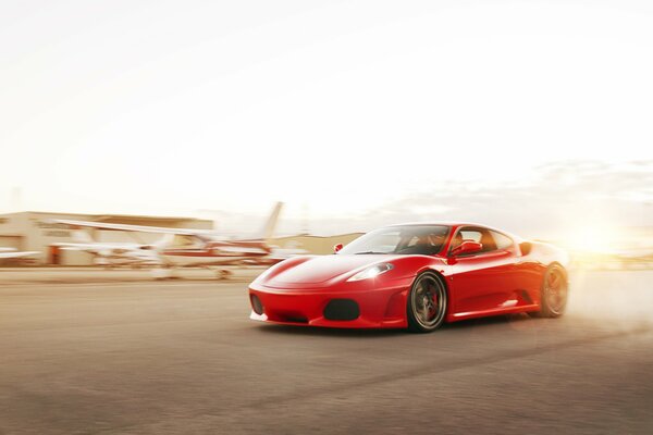 The red Ferrari fascinates with its beauty