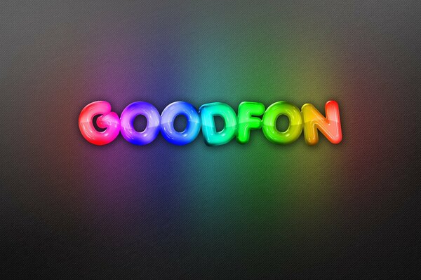 Rainbow neon lettering on a dark background
