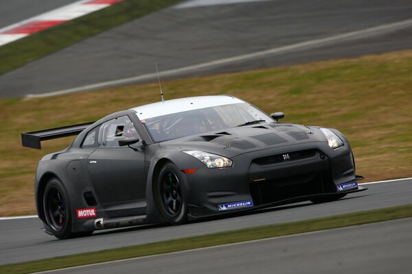 A racing car participates in a race on the track