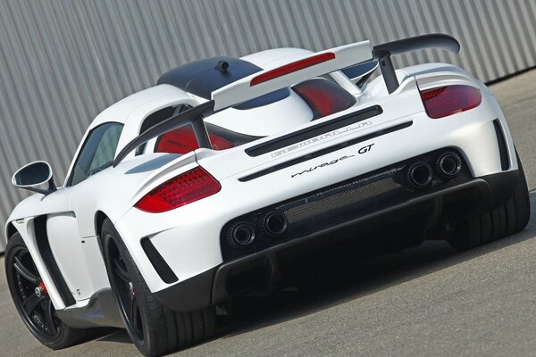 Beautiful white Porsche Carrera sports car with spoiler