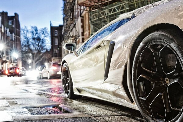 A beautiful car is driving along the road in the city