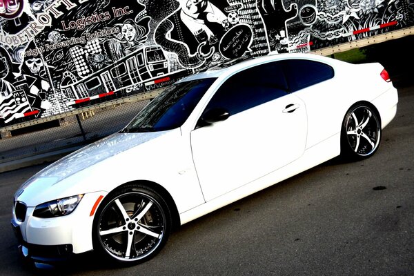 White BMW on graffiti background