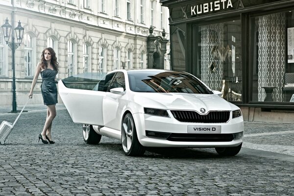 A beauty with long legs next to a white car