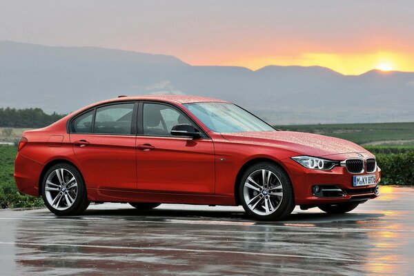 Boomer 3 series F30 on the background of rain