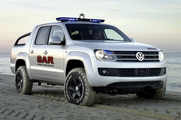 Volkswagen am Strand am Meer Foto