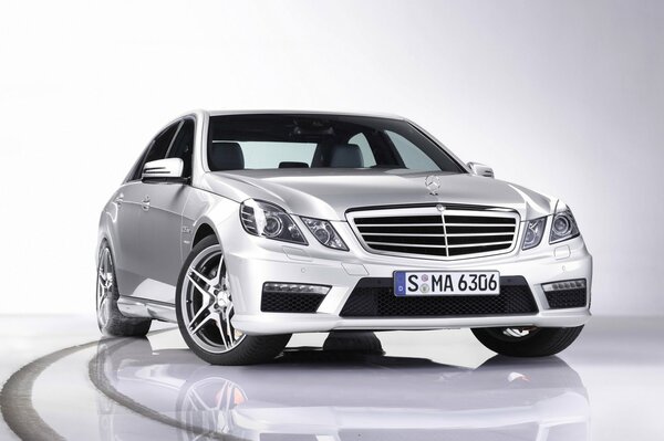 White German Mercedes-Benz E class on a white background