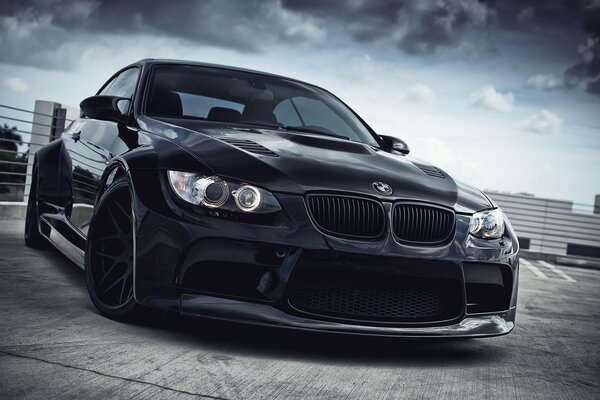 BMW car in daylight with clouds