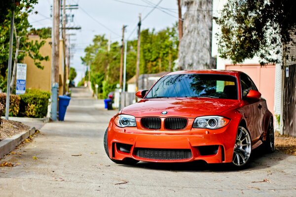 Red BMW on the background of the old town