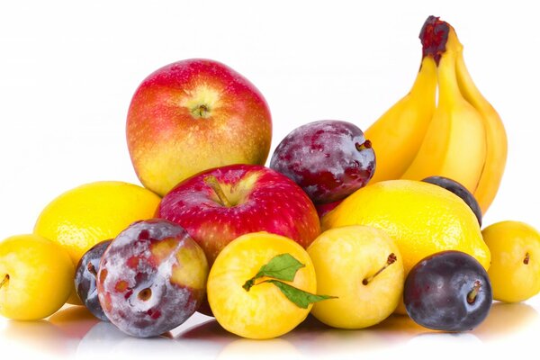 Fruit plate of plums apples and banana