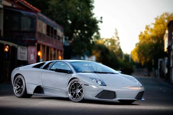 White sports Lamborghini among the city