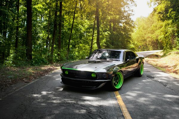 Black and green Ford Mustang, RTR-X in the woods on the road