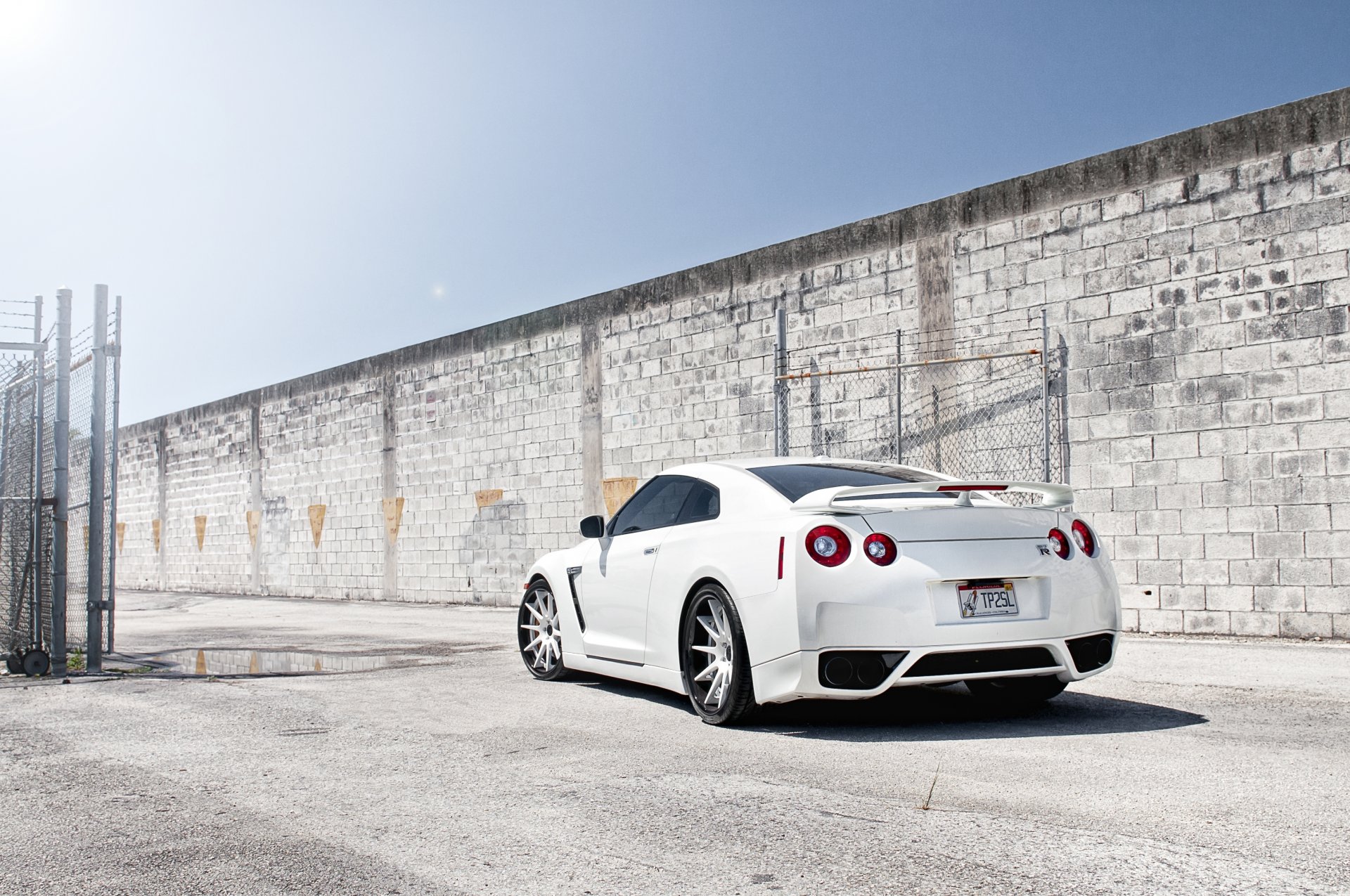 nissan gtr r35 nissan gtr white tuning wall fence grid sky sun puddle