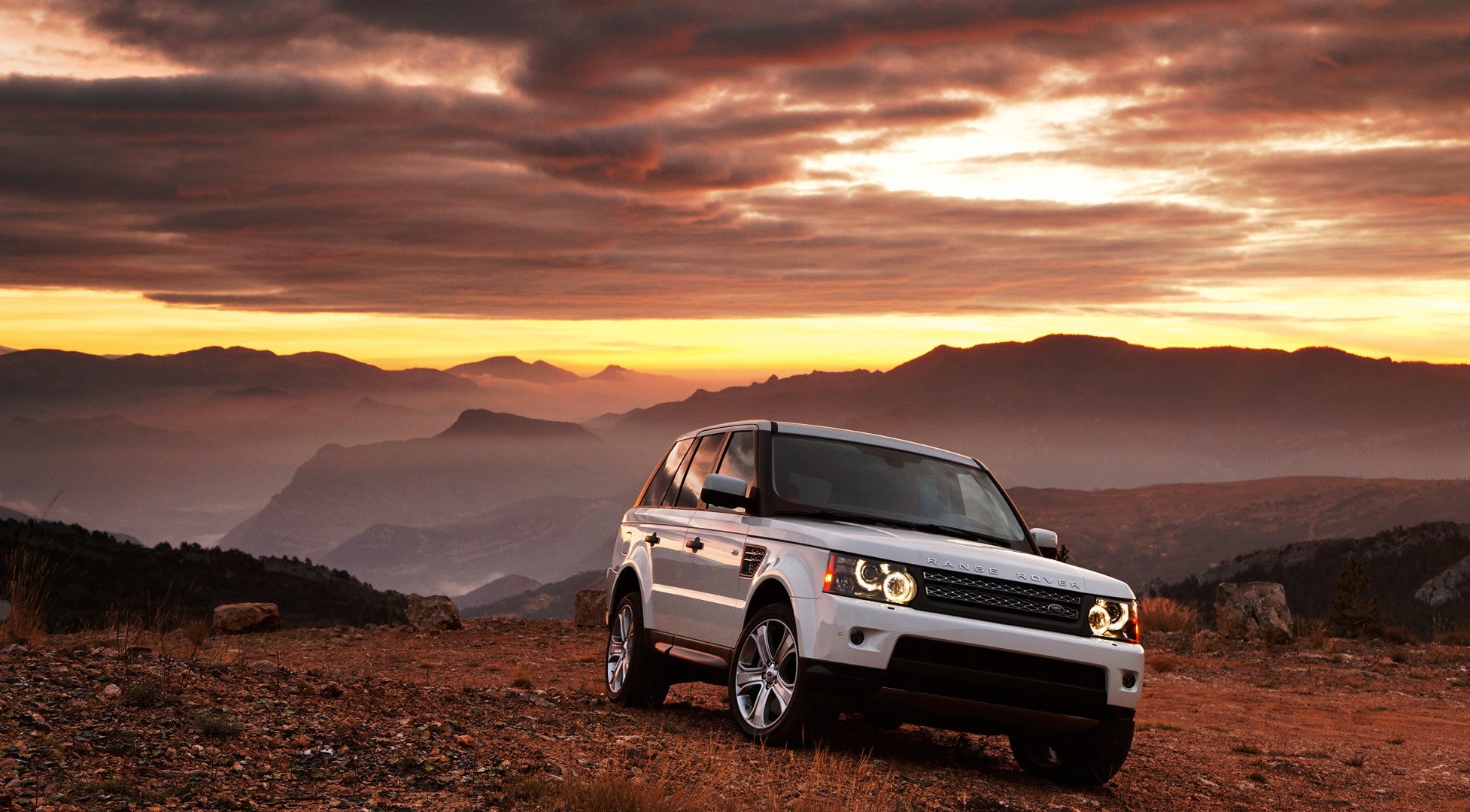 range rover white car sunset mountain