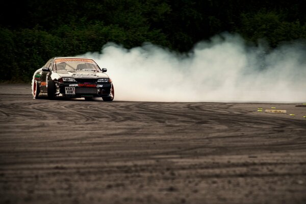 A loaded Nissan in a drift on the ground