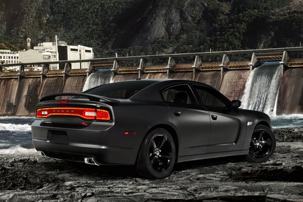 Black matte dodge on the background of the dam