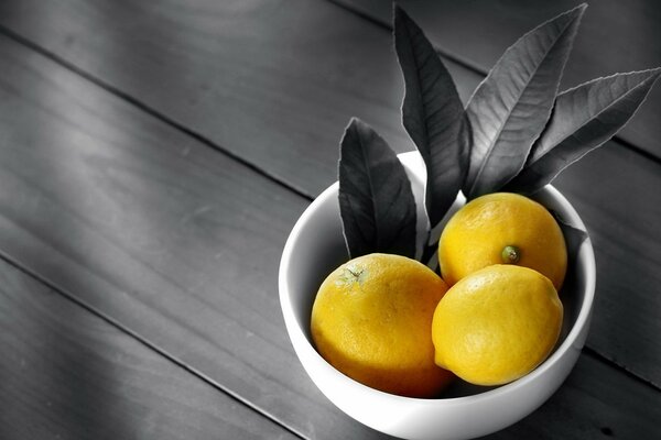 Juicy yellow lemons on a dark background