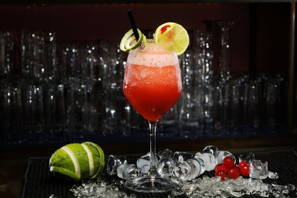 A glass with a drink on a dark background