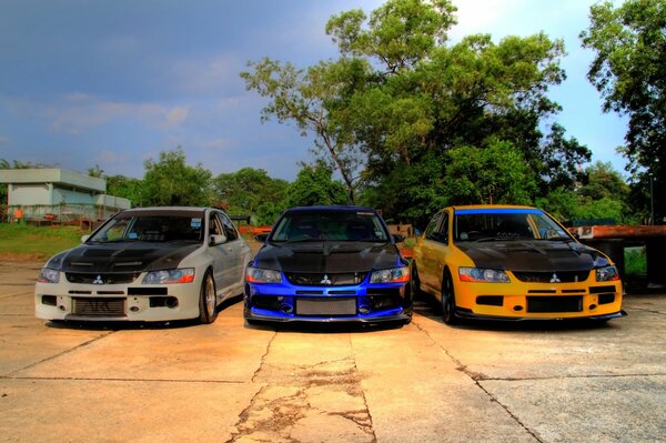 Three mitsubishi professional with black hoods