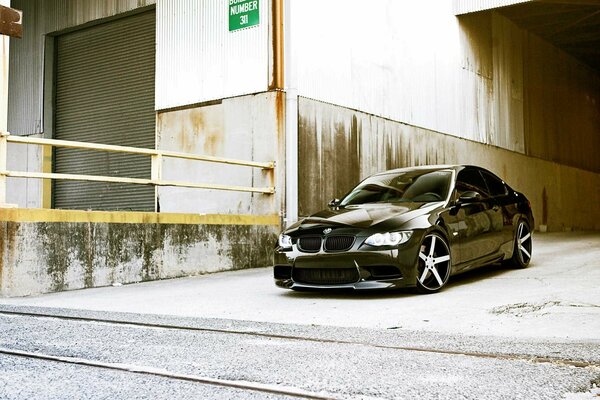 Black shiny BMW with silver wheels