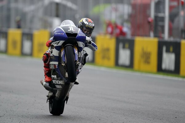 Rider on a motorcycle, on the way to the finish line in the competition