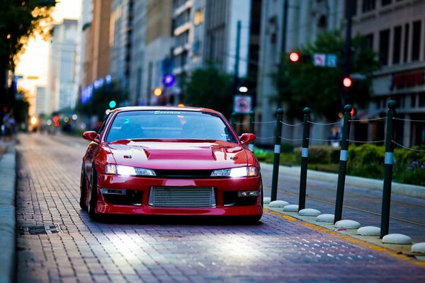 Red Nissan Sylvia s14 on the streets of the city